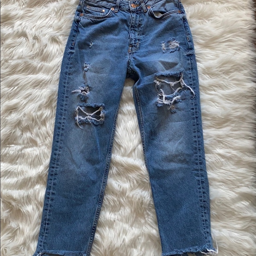 Distressed boyfriend jeans.